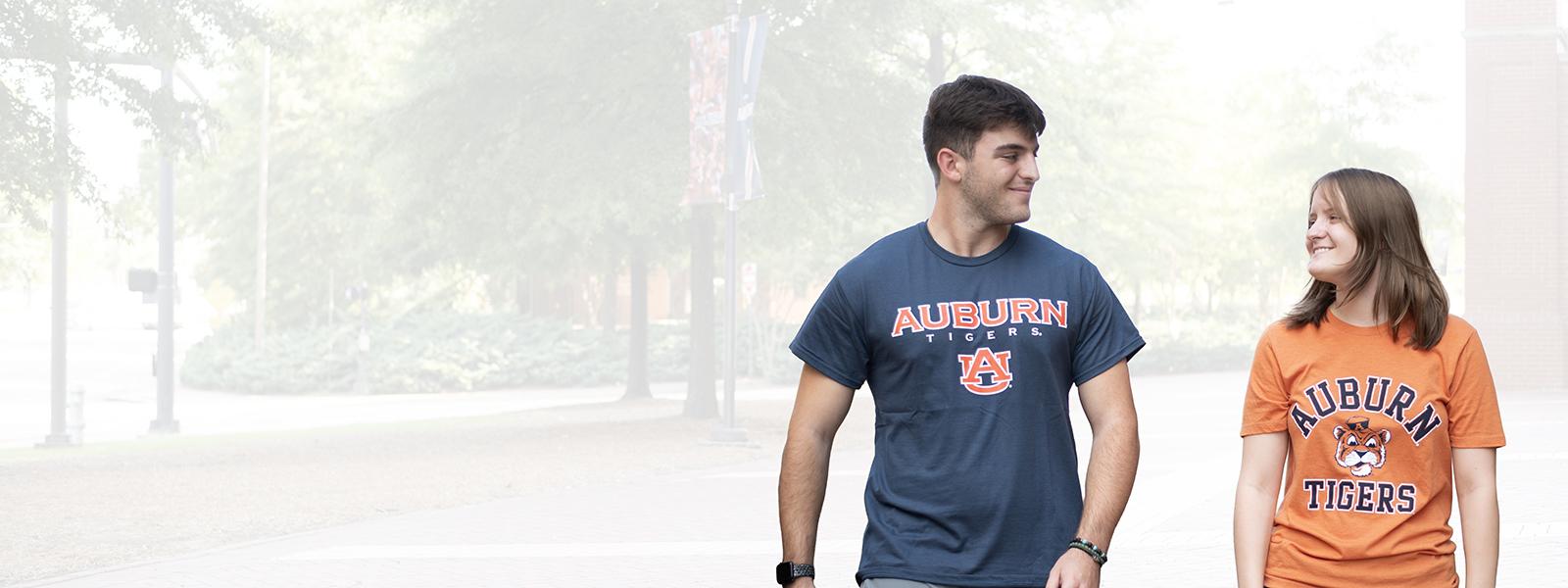 Auburn student in orange Auburn shirt and navy shirt