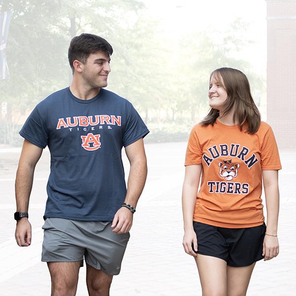Auburn student in orange Auburn shirt and navy shirt