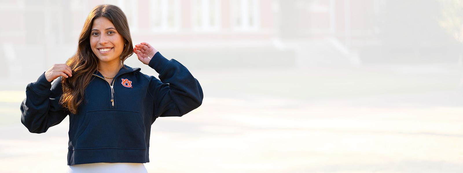 Auburn student wearing navy lululemon scuba with AU logo 