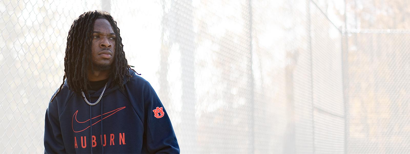 Auburn student wearing navy Nike hoodie