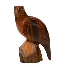 wooden eagle perched on block